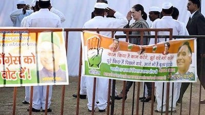 India's ruling Congress party president, Sonia Gandhi, salutes party volunteers as she arrives to address an election rally in Kangra, Himachal Pradesh.