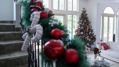 The staircase of Cotgrove's home is lined with garlands. Photo: Khushnum Bhandari / The National