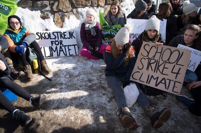 Greta Thunberg with students participate in a climate change strike. Laurent Gillieron / EPA