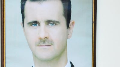 Prime Minister Imad Khamis, seen chairing a cabinet session in 2013, has been fired from his post. AFP