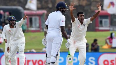 India’s Ravichandran Ashwin, right, successfully appeals for an lbw decision against Sri Lanka’s Rangana Herath. Ishara S Kodikara / AFP