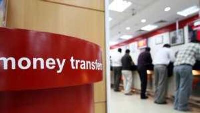 Customers use a money exchange branch in Karama, Dubai.