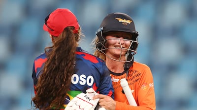 Laura Cardoso of Barmy Army congratulates Dani Wyatt of Falcons during their FairBreak Invitational match in Dubai. Getty