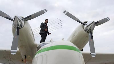Joshua Hucklebridge, one of the Americans killed in a plane crash in Al Ain last year, poses with the rare seaplane at the London Air Show in 2010. Courtesy: Elaine White