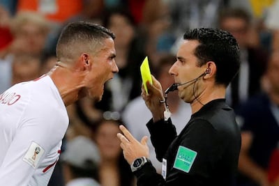 Cristiano Ronaldo remonstrates with referee Cesar Arturo Ramos during the 2-1 defeat to Uruguay, earning the Portugal captain a yellow card. Toru Hanai / Reuters