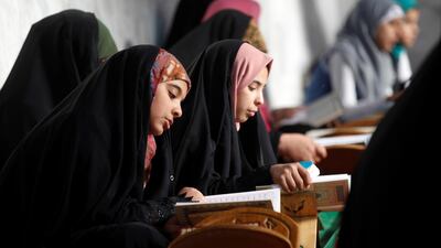 Women read the Quran at Al Qasim Mosque during the month of Ramadan in Hilla, Iraq. Reuters
