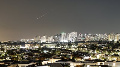 A streak of light illuminates the sky during a missile attack from Iran towards Israel. Reuters