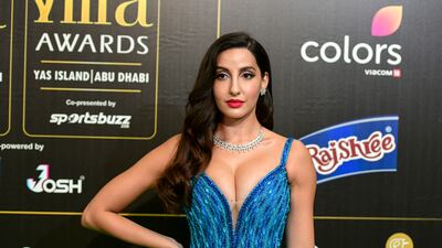 Nora Fatehi wearing a blue sequinned gown by Michael Cinco. Khushnum Bhandari / The National