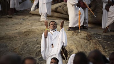 Muslim pilgrims gather on Mount Arafat, near Mecca, to take part in one of the Hajj rituals on October 3, 2014. The pilgrims perform a series of rituals during the annual Hajj. They circumambulate the kaaba seven times, runs back and forth between the hills of Al-Safa and Al-Marwah, drink from the Zamzam Well, goes to the plains of Mount Arafat to stand in vigil, and throws stones in a ritual Stoning of Devil. The pilgrims then shave their heads, perform a ritual of animal sacrifice, and celebrate Eid al-Adha holiday. AFP PHOTO/MOHAMMED AL-SHAIKH
