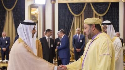 Sheikh Omar bin Zayed, Deputy Chairman of the Board of Trustees of the Zayed bin Sultan Al Nahyan Charitable and Humanitarian Foundation, left, greets King Mohammed VI of Morocco. Ryan Carter / Crown Prince Court - Abu Dhabi