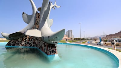 Sharks keep an eye on passing motorists from this roundabout in close to the Al Aqah hotels in Fujairah.