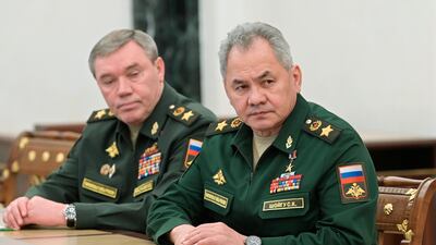 Russian Defence Minister Sergei Shoigu (R) and Chief of the General Staff Valery Gerasimov listen to a speech by President Vladimir Putin in Moscow. AP Photo