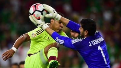 Mexico goalkeeper Jesus Corona catches the ball next to Venezuela’s Jose Salomon Rondon. Alfredo Estrella / AFP