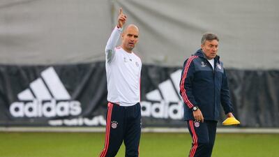 Pep Guardiola manager of Bayern Munich (L) signals during a FC Bayern Munich training session ahead of their Uefa Champions League semi-final second leg match against Atletico Madrid at the Sabener Strasse training ground on May 2, 2016 in Munich, Germany. (Photo by Alexander Hassenstein/Bongarts/Getty Images)