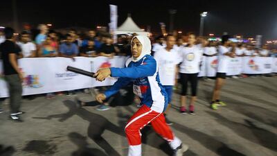 Fatiha Benhaddou from the SPIE team takes part in the Abu Dhabi Dash. Pawan Singh / The National