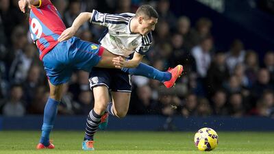 Crystal Palace's Marouane Chamakh, left, vies for the ball with West Bromwich Albion's Graham Dorrans during their 2-2 draw in the Premier League on Saturday at The Hawthorns. Oli Scarff / AFP