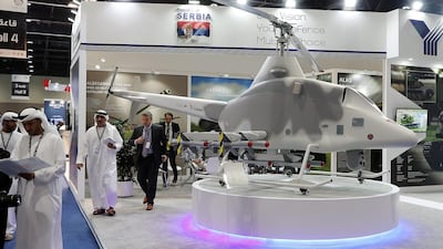 Visitors look at a drone at the Republic of Serbia stand on the first day of the UMEX held at ADNEC in Abu Dhabi. Pawan Singh / The National