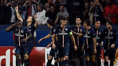 PSG defender David Luiz, second from left, celebrates after scoring a goal during the Uefa Champions League football match against Barcelona on September 30, 2014 at the Parc des Princes stadium in Paris. AFP PHOTO / FRANCK FIFE