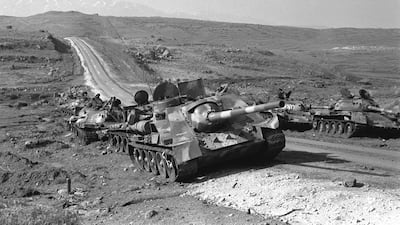 The remnants of Syrian tanks struck by the Israeli air force are left to rust by the roadside, after fighting in October 1973