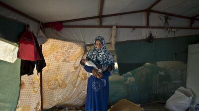 Feedah Ali, 18, holds her daughter Khadija, 2 days old.