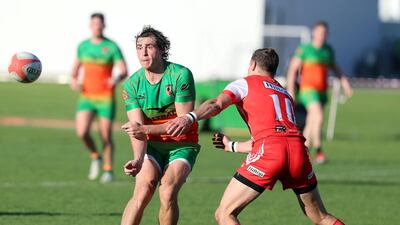 Dubai, United Arab Emirates - Reporter: Paul Radley: Eagles Jamie Gavin is tackled by Tigers Adam Webber. Dubai Tigers (red) take on the Dubai Knights Eagles in the West Asia Premiership. Friday, February 14th, 2020. Dubai College, Dubai. Chris Whiteoak / The National