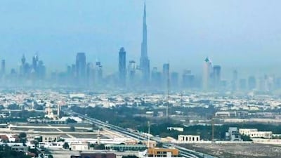 Scientists are to study what effect car exhaust fumes have on smog such as that shrouding the Dubai skyline last year. Jeff Topping / The National