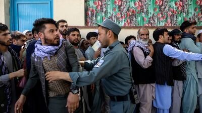 Afghans have been waiting for hours in long queues outside the passport office in Kabul, with many people desperate to leave the country.