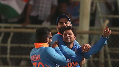Kuldeep Yadav, centre, will be hoping to become a regular in the playing XI. AFP