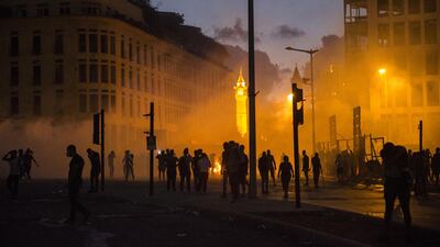 A cloud of tear gas drifts through a crowd of protesters during a protest at Martyrs Square. Getty Images