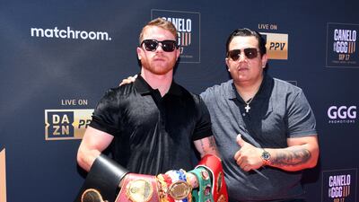 Saul 'Canelo' Alvarez and trainer Eddy Reynoso. AFP