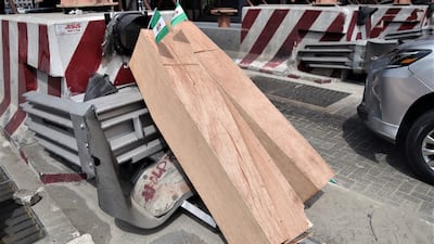 Protesters place coffins at the Lekki toll gate during the rally. EPA