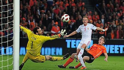 Dirk Kuyt, in orange, shoots and scores in Holland's 5-3 victory against Hungary.