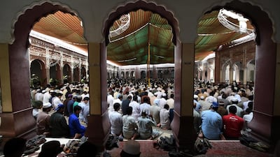 Pakistani residents offer Friday prayers at a mosque during the first Friday of Ramadan in Peshawar. Abdul Majeed / AFP