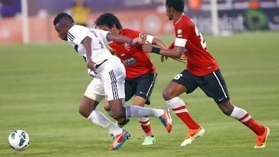 Asamoah Gyan, left, says teams, such as Al Ahli and Al Jazira, will chase Al Ain in the upcoming season but will not catch them.