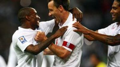 Jermain Defoe, left, of England celebrates scoring the fifth goal of the game with John Terry and Glen Johnson during match against Andorra.