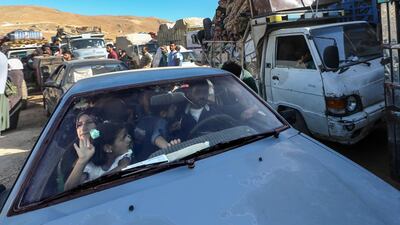 epa06906535 Syrian refugees sit inside their cars waiting to be evacuated from their refugee camps in the village of Arsal, east of Lebanon, 23 July 2018, to return home to their villages in al-Qalamoun area in the western Damascus countryside. According to media reports, Lebanon hosts 1,011,366 Syrian refugees registered with UNHCR, Including 80 thousand refugees living in seven camps in the city of Arsal. 850 person who have permission from the Syrian authority left to return home on 23 July 2018, where tousends of Syrian refugees families registers their names and wait the syrian permission. EPA/NABIL MOUNZER