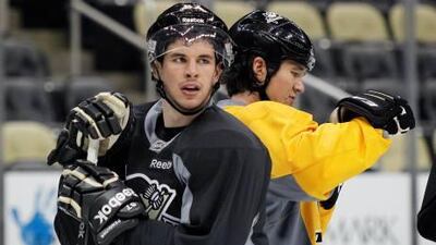 Sidney Crosby, left, in practice with Pittsburgh Penguins' teammates on Thursday.