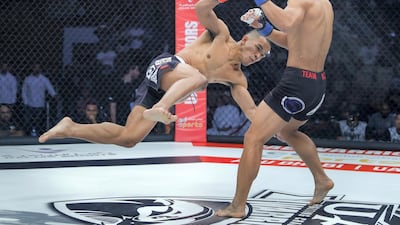 Rolando Dy slips during his fight against Lee Do-gyeom. Victor Besa/The National