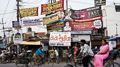 English language schools advertise at an intersection in Kanpur, Uttar Pradesh, where learning English has become the key to upward mobility.
