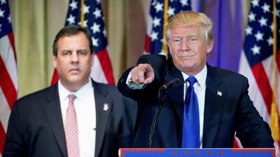 Republican presidential candidate Donald Trump, accompanied by New Jersey Gov Chris Christie, left, takes questions from members of the media during a news conference on Super Tuesday primary election night. Andrew Harnik / AP Photo