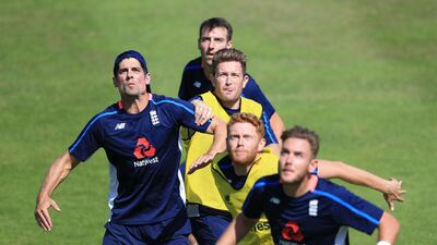 England players Alastair Cook, left, Toby Rowland-Jones, back, Liam Dawson, second back, Jonny Bairstow, second front, and Stuart Broad, bottom, play football during the nets session at Lord's on Wednesday. Nigel French / Press Association
