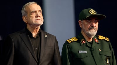 New security chief Mohsen Rezaei, right, and Iranian President Masoud Pezeshkian attend a funeral ceremony for supreme leader Ayatollah Ali Khamenei in Tehran in July. Reuters
