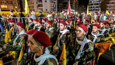 Hezbollah members listen to a televised speech by the group's leader Hassan Nasrallah in Beirut. EPA