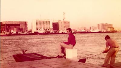 Rafiq Kasim sitting by Dubai Creek