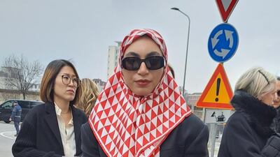 Pairing an oversized suit with a Prada scarf