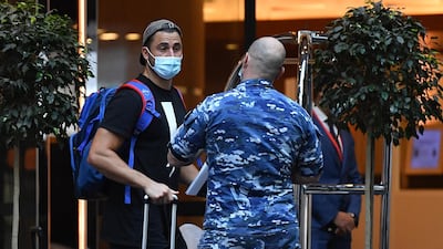 Australian all-rounder Marcus Stoinis arrives for hotel quarantine at the Marriott Hotel in Sydney. EPA