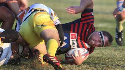 Abu Dhabi Saracens, in red and black, in action during the Gulf Top Six tournament in February 2015. Delores Johnson / The National