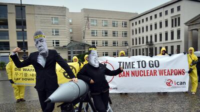 Aactivists of the International Campaign to Abolish Nuclear Weapons (ICAN) protest against the conflict between North Korea and the USA with masks of the North Korean ruler Kim Jong-un, right, and the US president Donald Trump, left, in front of the US embassy in Berlin, Germany. The group has been named the Nobel Peace Prize winner for 2017. Britta Pedersen / dpa via AP