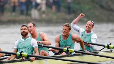 British rower James Cracknell, third from left, of team Cambridge celebrates with teammates after beating Oxford in the Boat Race on the River Thames in London. AFP