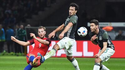 Harry Kane (L) of England shoots at goal while Mats Hummels (C) and Jonas Hector (R) of Germany try to block during the International Friendly match between Germany and England at Olympiastadion on March 26, 2016 in Berlin, Germany. (Photo by Matthias Hangst/Bongarts/Getty Images)